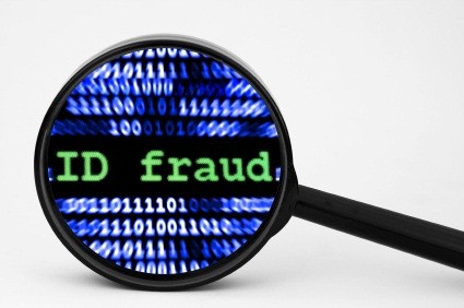 Close up of magnifying glass on ID fraud